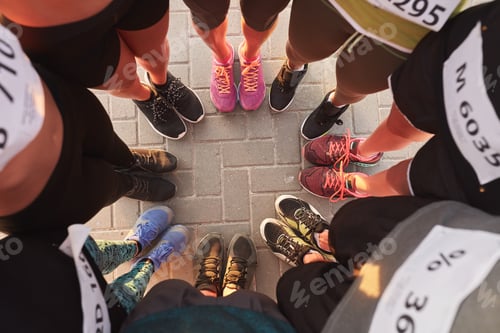 Preview: Feet of runners standing in a circle
