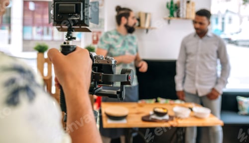 Preview: Unrecognizable camera operator recording cooking workshop