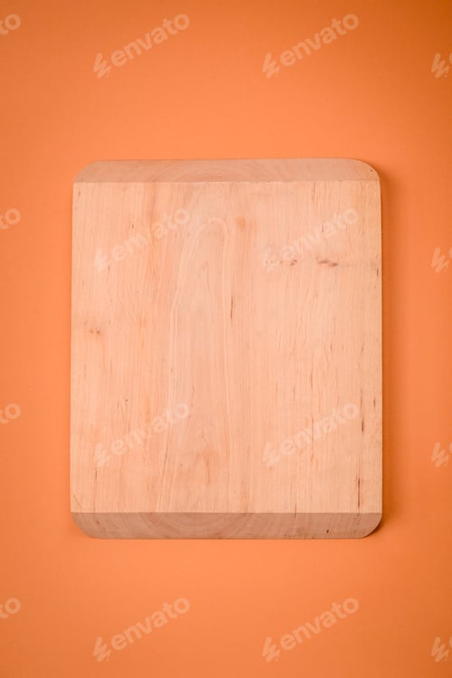 Preview: Empty wooden rectangular cutting board on a plain background, flatley with copy space
