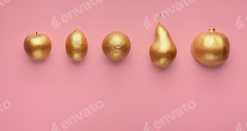 Preview: Golden fruits in row on pink