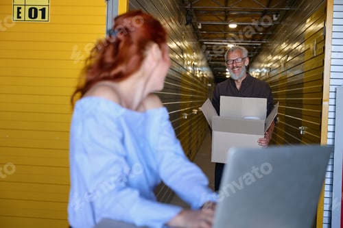 Preview: 35 plus couple communicating in storage warehouse