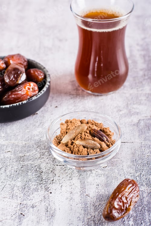 Preview: Bowl with date pit powder for making coffee on the table. Caffeine Free Alternative to Coffee.