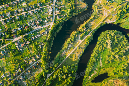 Preview: Aerial View Of Calm River And Village In Belarus, Europe. Green Forest Woods Landscape In Sunny