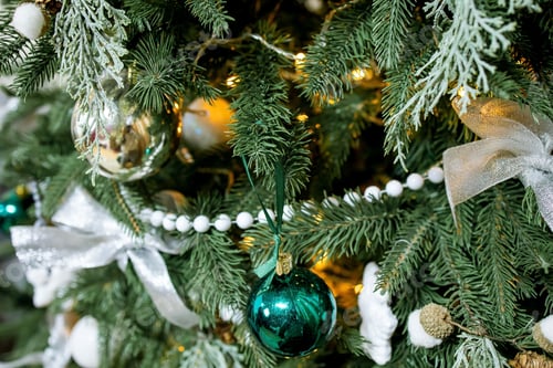 Preview: Close up balls on the Christmas tree. Bokeh garlands in the background. New Year concept.