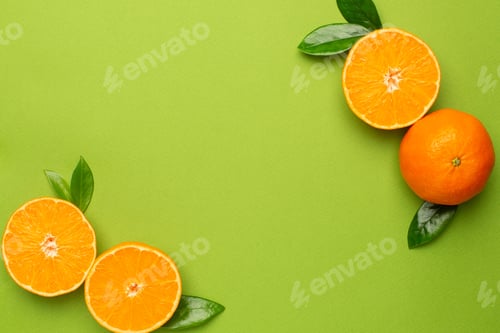 Preview: Tangerine on an green background, fruit flatlay, summer minimal compositon with copyspace