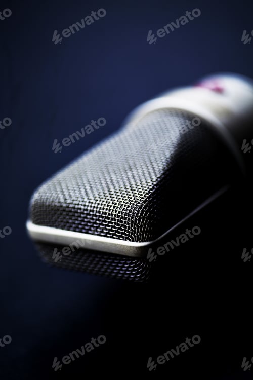 Preview: Close-up of microphone against black background