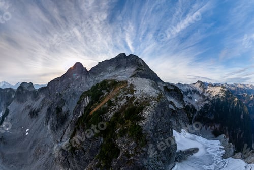 Preview: Alpine Ridge Above Snowy Peaks in British Columbia, Canada at Sunset