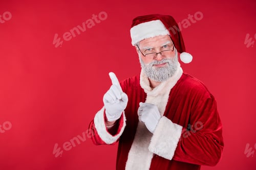 Preview: Senior Santa Claus Making Pointing Gesture with Index Finger