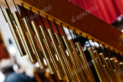 Preview: Musical detail of a golden Windchimes.