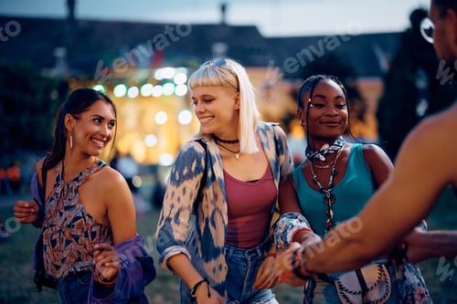 Preview: Smiling Young Women Enjoying Outdoor Music Event