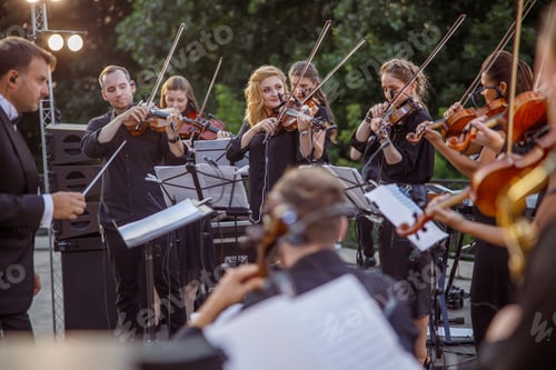 Preview: Violin players playing classic instrumental music outdoors