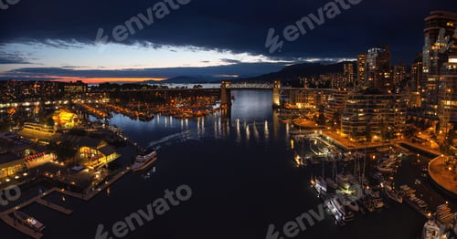 Preview: Aerial panoramic view of Downtown City during a cloudy night after sunset