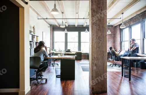 Preview: Asian woman working at her desk in a creative office.