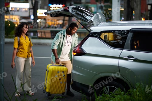 Preview: Putting packed suitcases in car trunk