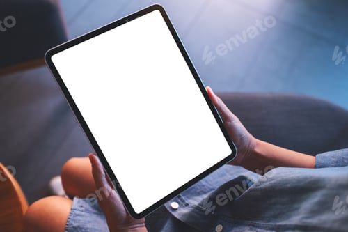 Preview: Mockup image of a woman holding digital tablet with blank white desktop screen in cafe
