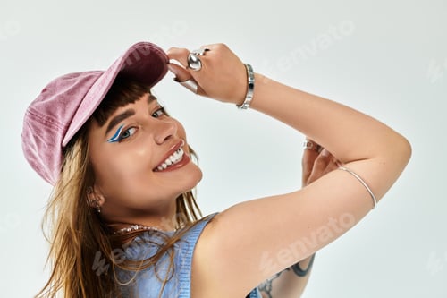 Preview: Stylish young woman showcases her fashion sense with vibrant accessories and a playful pose