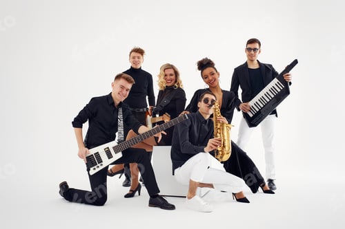Preview: Portrait of diverse group of young people musical band playing with instruments - isolated on white