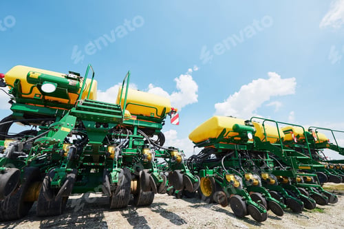 Preview: Close up of seeder attached to tractor in field. Agricultural machinery for spring works sowing