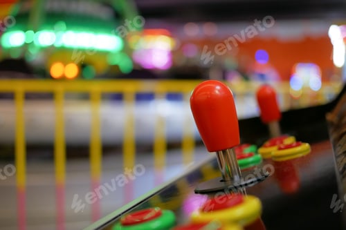 Preview: closeup of button on games machine.