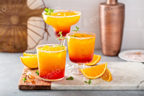 Preview: Tequila sunrise margarita cocktail with ice, refreshing drink