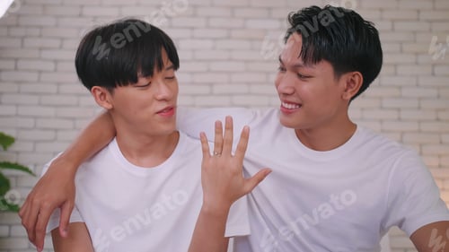 Preview: Smiling Couple Celebrate an Engagement with Wedding Ring