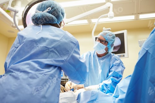 Preview: Surgical Team Working In Operating Theatre