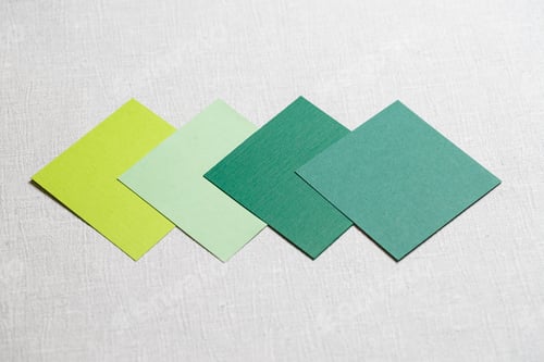 Preview: square pieces of multi-colored fabric laid out on a gray background