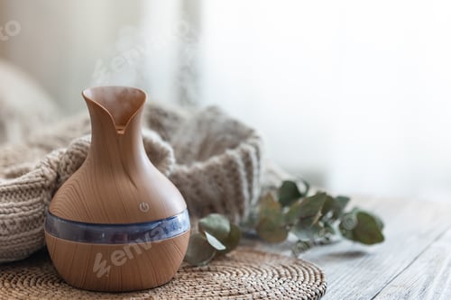 Preview: Spa composition with aroma oil diffuser lamp on a blurred background.