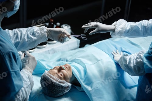 Preview: Surgeons Perform Operation On Patient in Operating Room