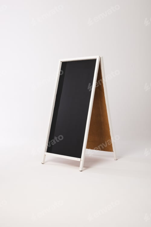Preview: Black sign in white frame and copy space on white background