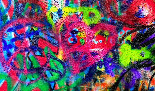 Preview: Detail of bright colorful John Lennon's wall with graffiti in Prague