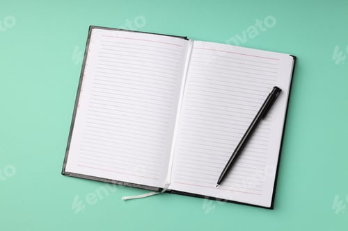 Preview: Blank notebook with pen on mint background