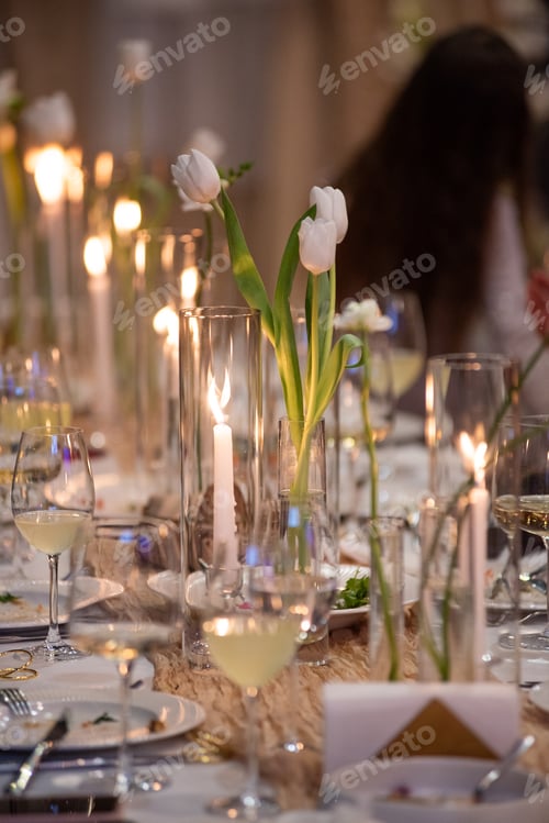 Preview: beautiful table setting with flowers and cutlery on wooden table at wedding or dinner. stylish table