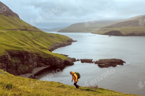 Preview: Dramatic view of green hills of Vagar island and Sorvagur town