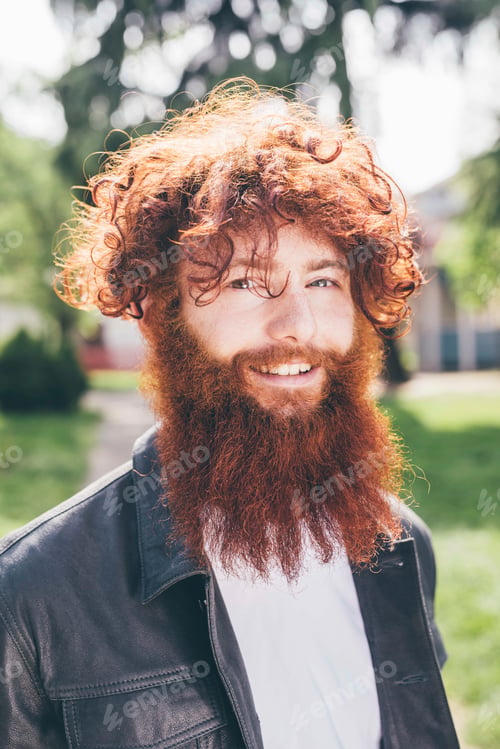 Preview: Smiling man with red curly hair and beard