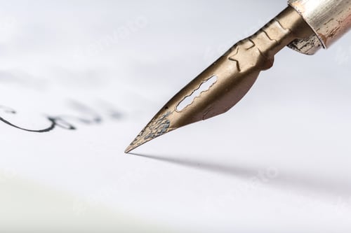 Preview: Writing with a fountain pen on white paper in a well-lit space