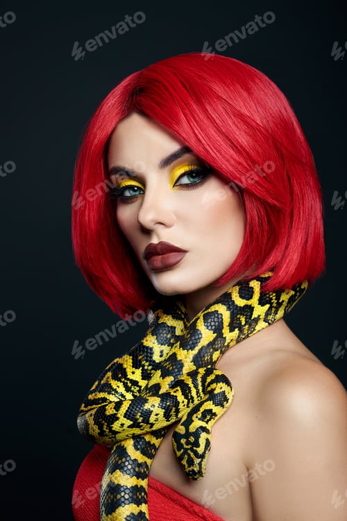 Preview: Beautiful woman with red hair and a yellow python snake around her neck. Professional Makeup
