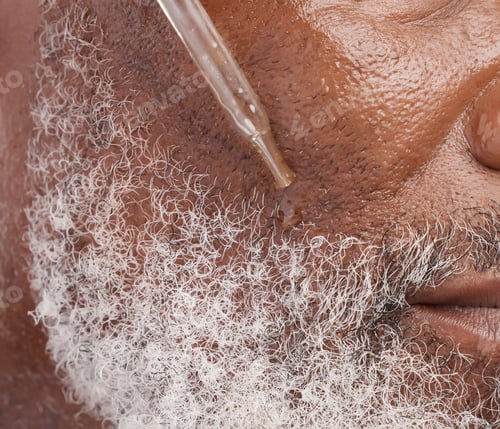 Preview: Skincare, serum and face of senior man in studio for wellness, cosmetics and facial hair care. Derm