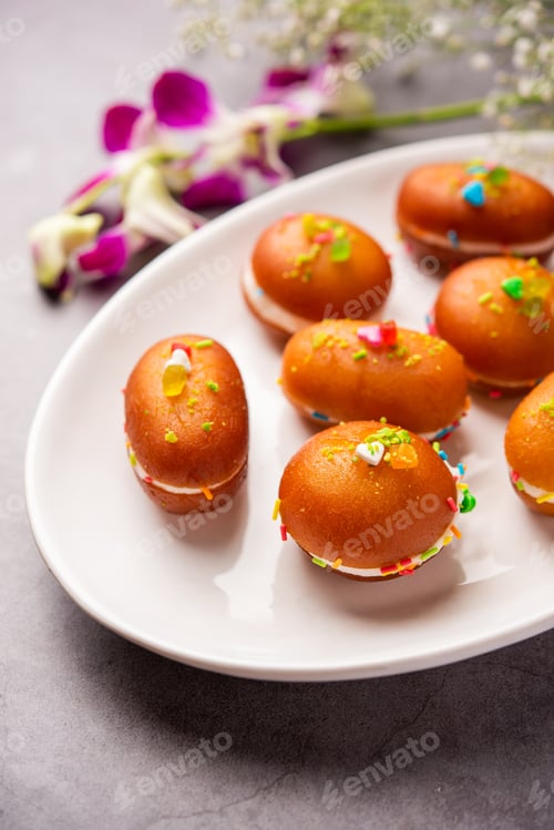 Preview: Malai Chop or Cream sandwich made using filling Rasgulla or Gulab jamun sweet is a Bengali sweet
