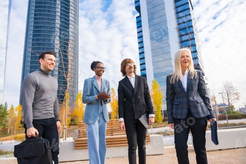 Preview: Group of multi-ethnic businessmen and businesswomen, talking about work in a business park