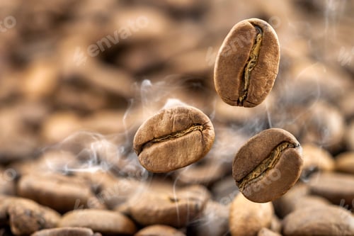 Preview: Flying fresh coffee beans as a background with copy space.