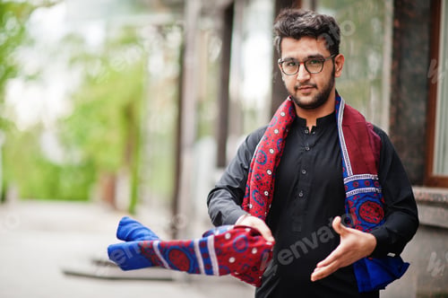 Preview: Pakistano bangladesh man wear black traditional clothes and eyeglasses pose outdoor.