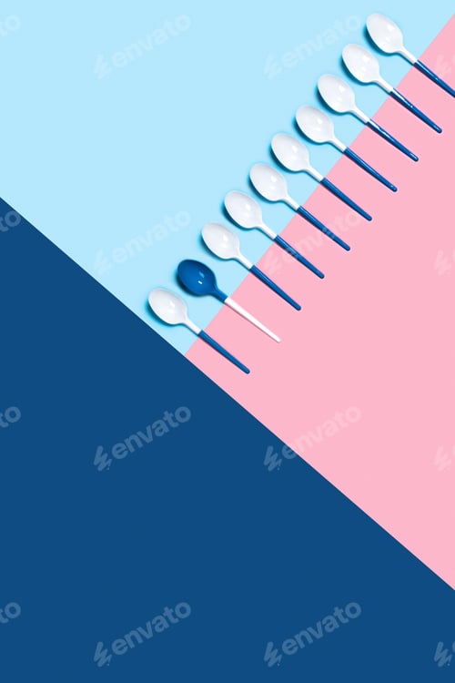 Preview: Plastic spoons on tricolor background.