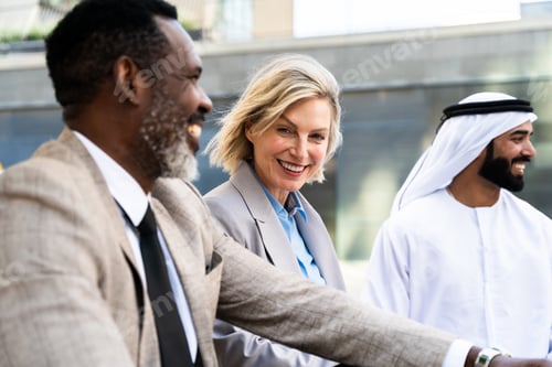 Preview: Group of multiethnic business people meeting an emirati businessman