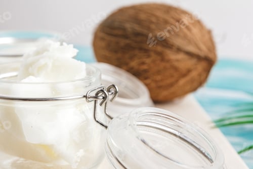 Preview: Coconut butter on wooden background. Organic healthy food concept