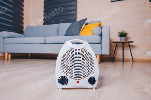 Preview: A Modern Electric Heater Positioned in a Cozy Living Room with a Sofa, Floor, and Decorative...