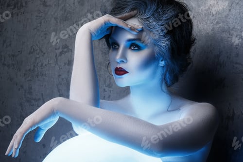 Preview: Woman in creative makeup and body-art in image of a soothsayer