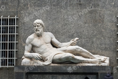 Preview: reclining stone statue on gray wall