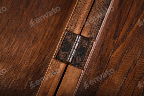 Preview: Door Hinges Against A Wooden Background. Rusty Iron Details On A Dark Wooden Background.