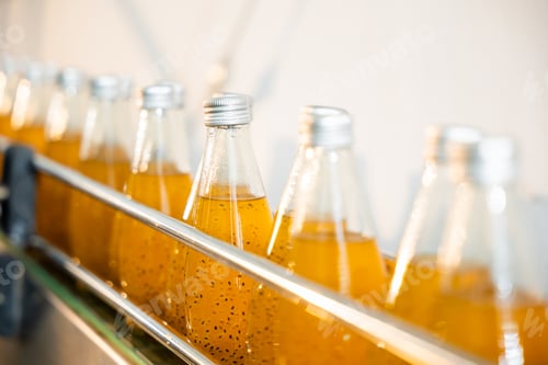 Preview: Basil or chia seed beverages with pomegranate undergo quality filling into transparent bottles